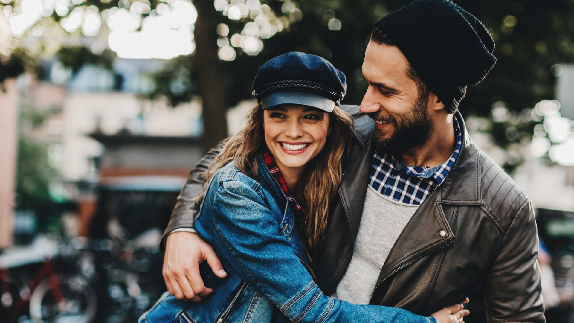 YOung couple walking happily down the road