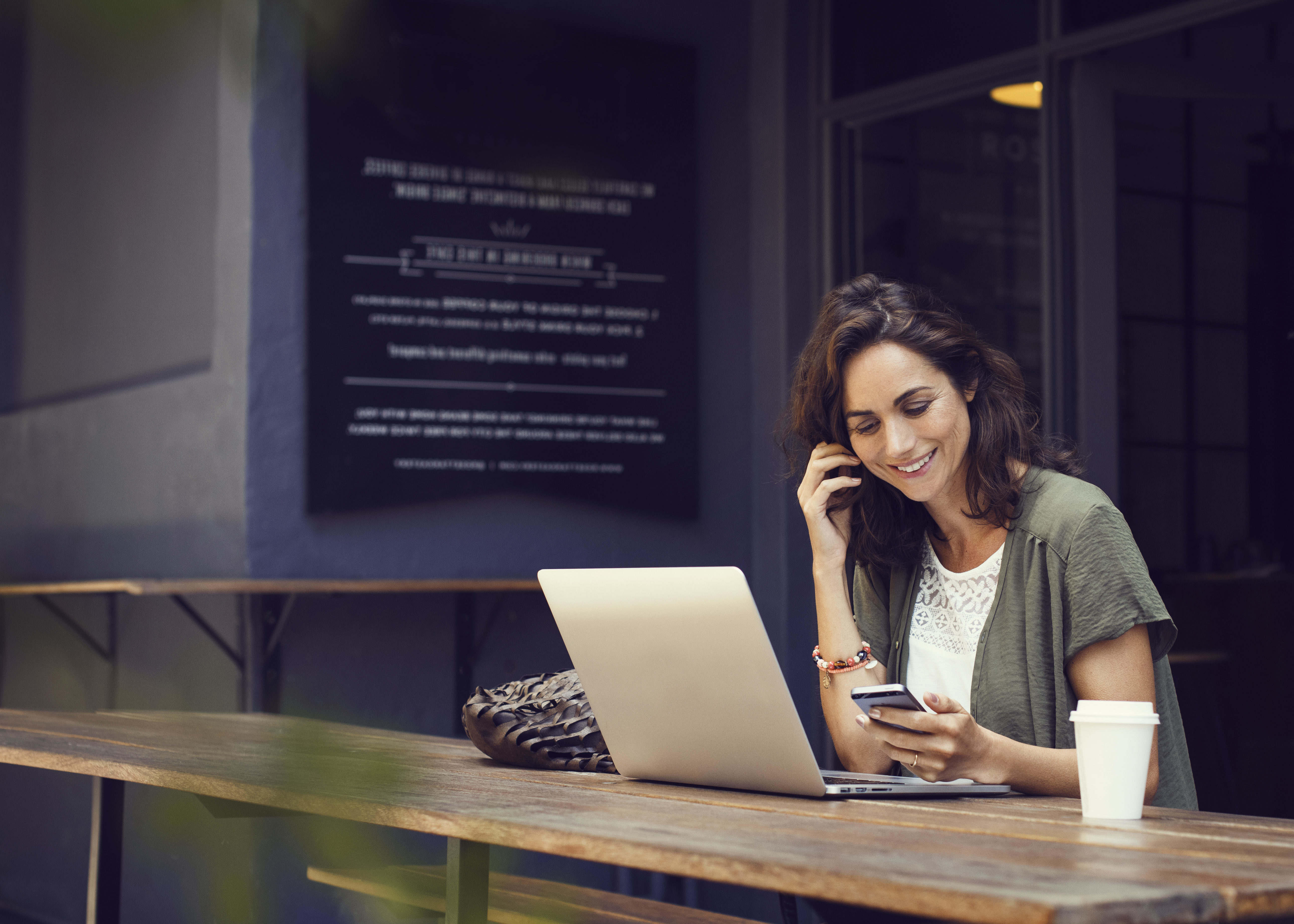 woman trying out online dating on her smart phone