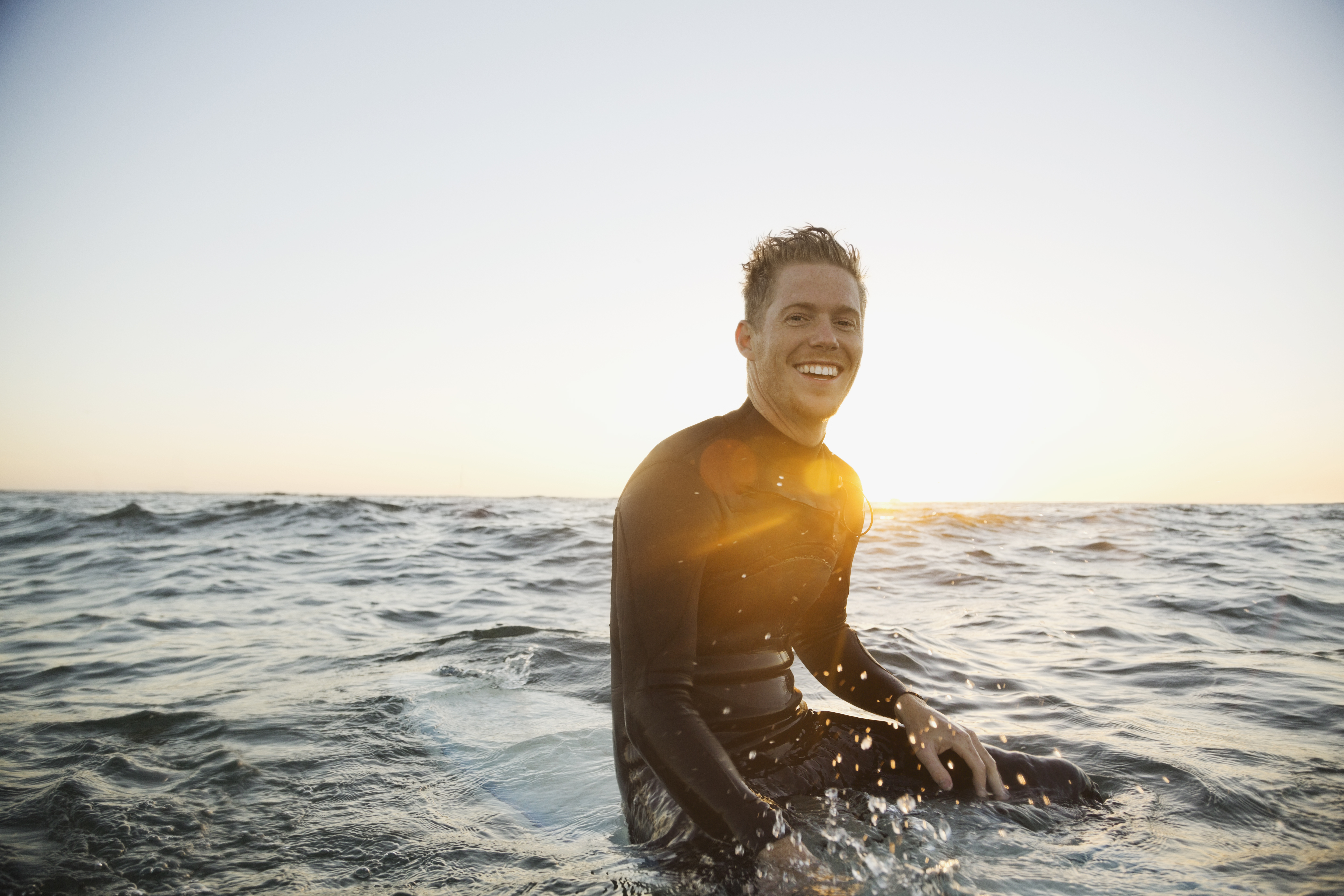 Man with glowing confidence out surfing