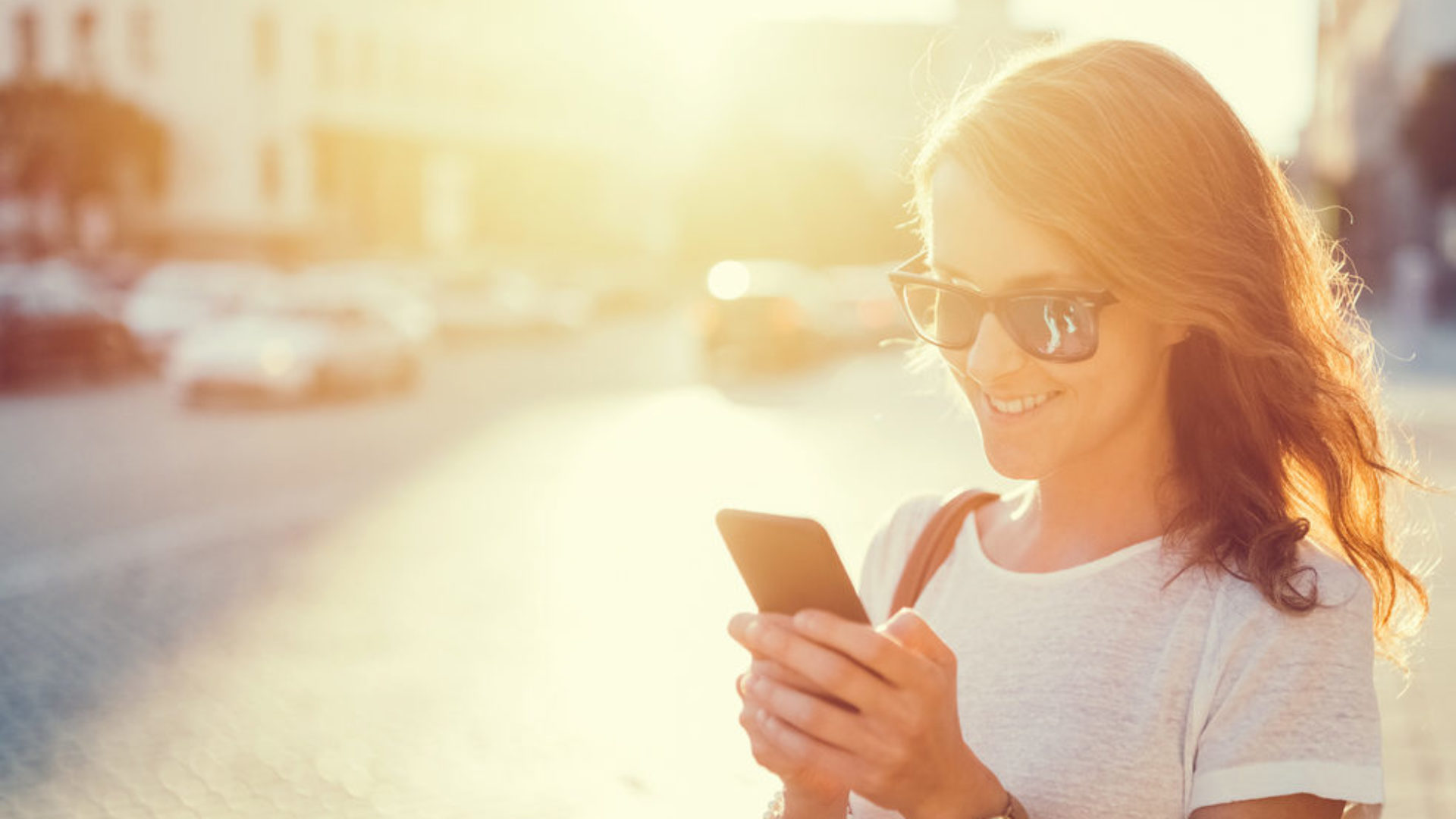 Young woman looking at her smartphone