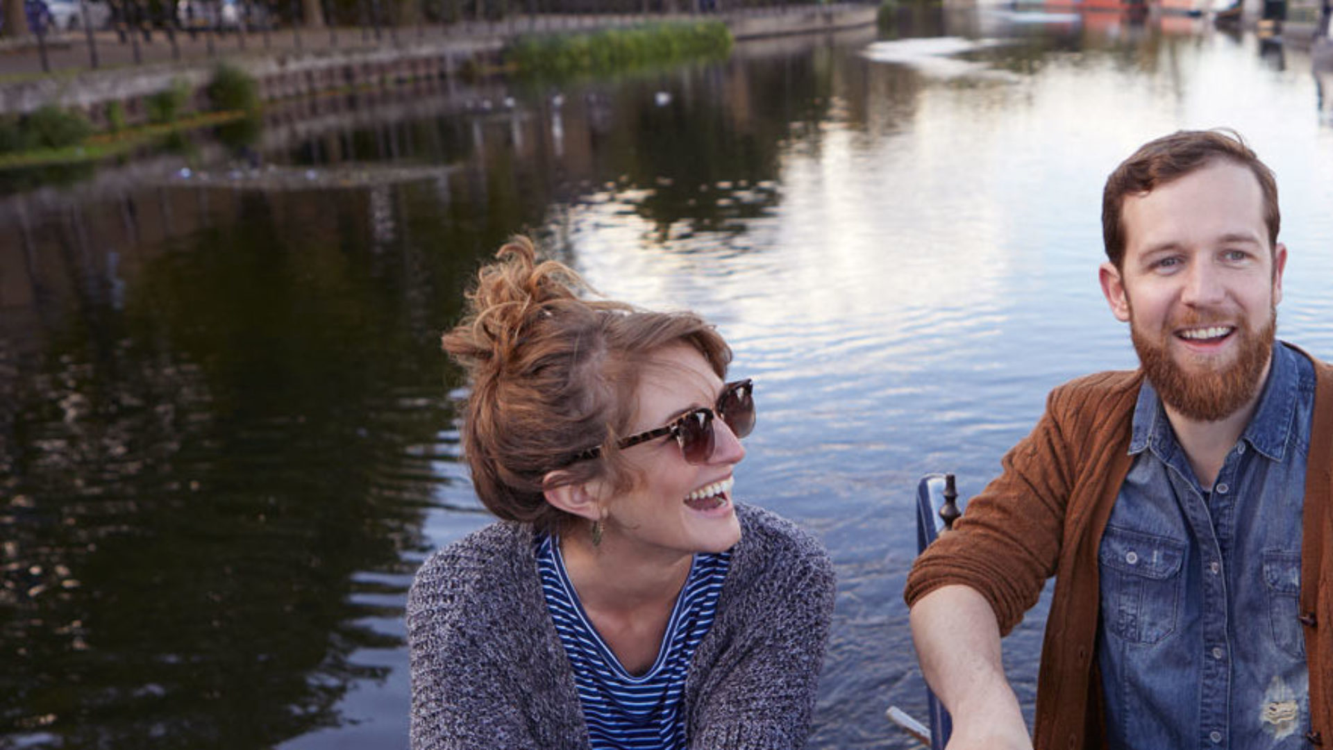 UK Couple sailing on a canal boat