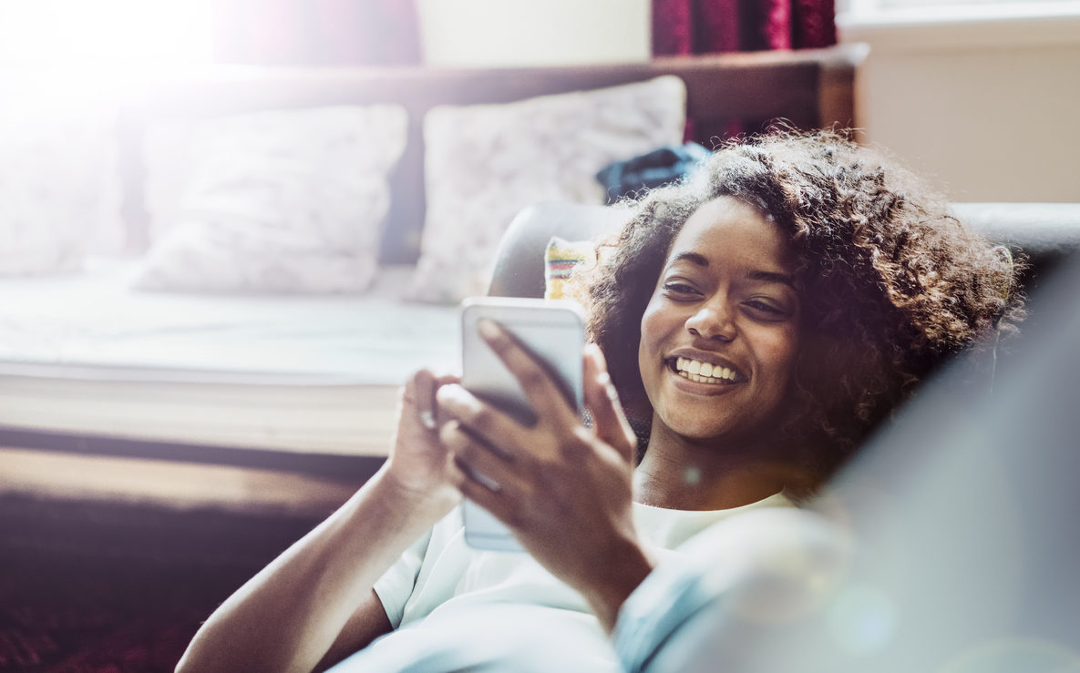 A photo of young woman using mobile phone.