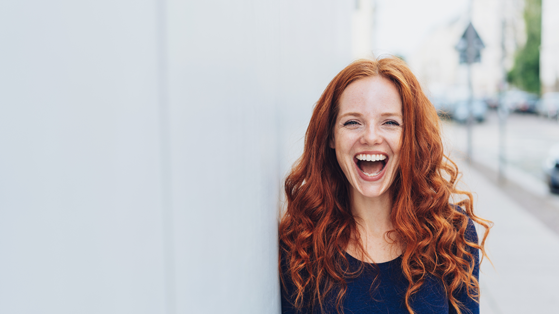 Woman with confidence in God laughing happily