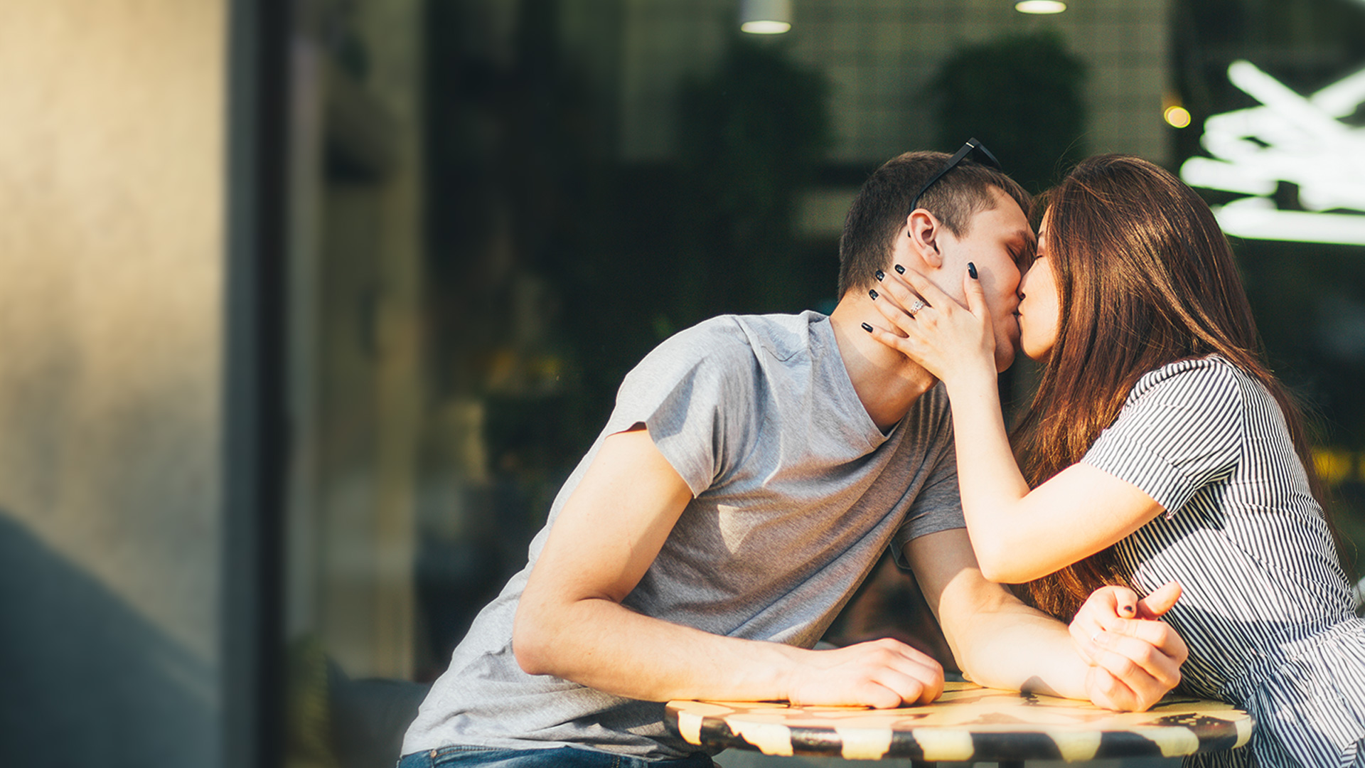 kissing couple whose relationship is moving too fast