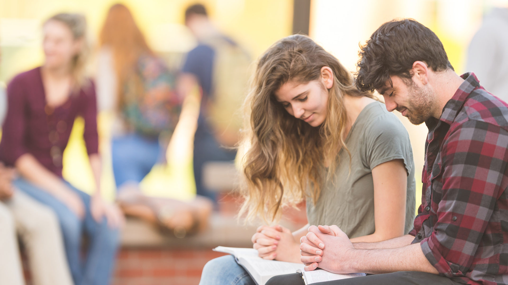 Couple strengthening their relationship through prayer